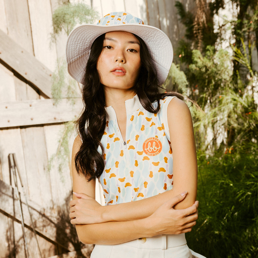Sleeveless Bunker Zip Top - เสื้อแขนกุด คอสูงมีซิบ ลายบังเกอร์ (White)